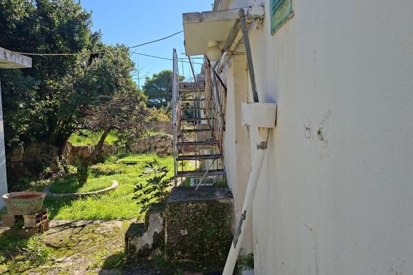 Side of house with metal stairs in Mihalitsata - property id 3361